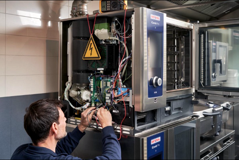 Expert technician performing rapid commercial equipment diagnosis and repair