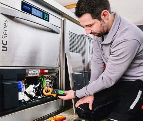 WeFixFaults technician servicing commercial equipment